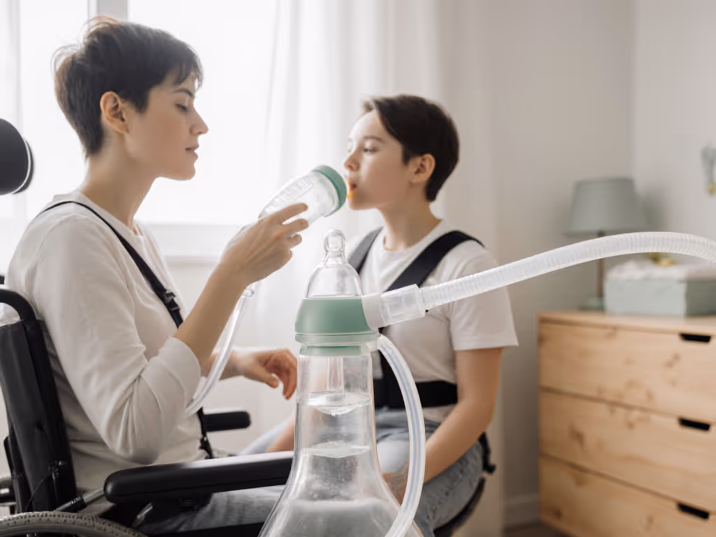 adult_using_hands-free_bottle_system_with_tubing